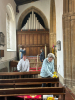 Debbie helping Brenda to polish the pews.
